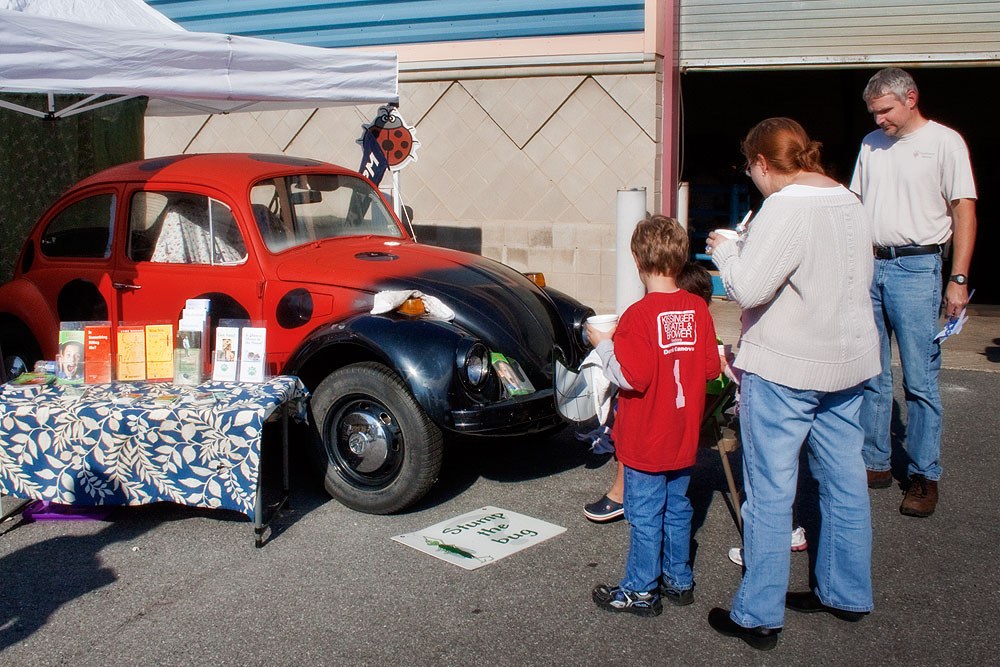 Kids and parents try to stump the talking car with their questions. Photo by Nick Sloff