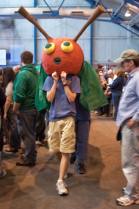 he "Very Hungry Caterpillar" roams the event floor advertising for the Ladybug Theatre inside the Centre County/Penn State Visitor Center. Photo by Nick Sloff