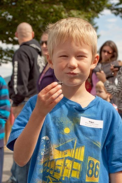 Nicholas enjoys some sushi from the insect deli. Photograph by Nick Sloff