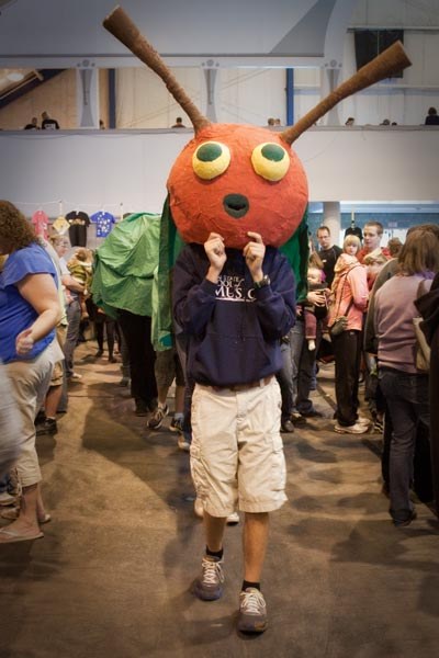 The "Very Hungry Caterpillar" roams the event floor advertising for the Ladybug Theatre inside the Centre County/Penn State Visitor Center. Photograph by Nick Sloff