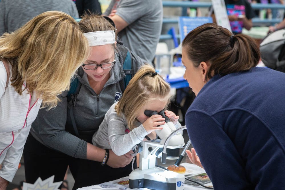 A mother and daughter enjoy displays at the annual Great Insect Fair 