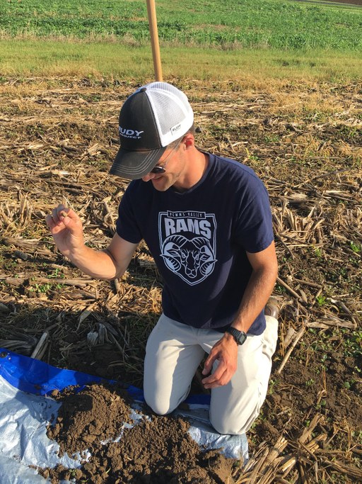 Hayden Bock enjoying going through a soil sample at Rock Springs.