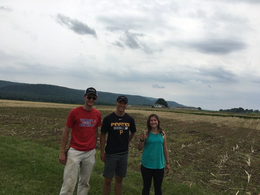 Hayden Bock, Garrett Reiter, and Sonia Klein walking the research fields at Rock Springs. 