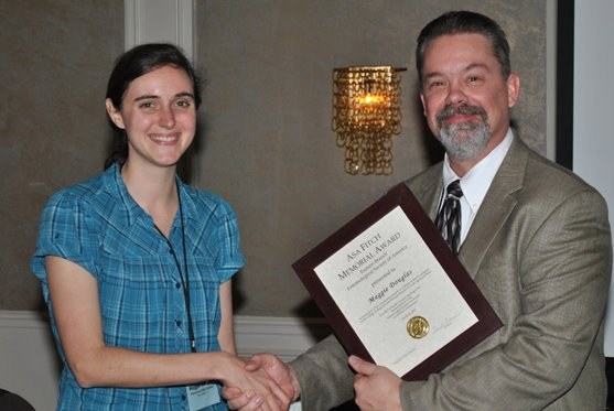 George Hamilton (Rutgers Univ.) presents Maggie with Asa Fitch Award for the Best Masters Student in the Eastern Branch of the Entomological Society of America.